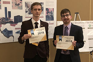 Bogdan Kapatsila and Harrison Freund holding their award certificates.