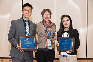 Haifeng Qian and Shiqin (Shirley) Liu holding their awards.