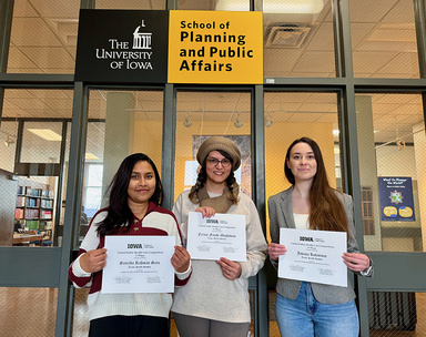 Group picture of three SPPA students who won the 2024 Glabal Health Case Competition, each holding their certificate.