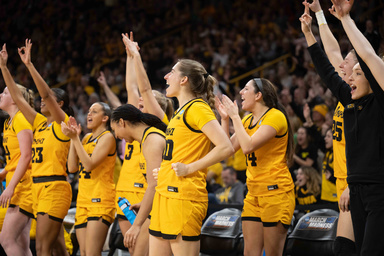 Iowa women's basketball team cheering the players on