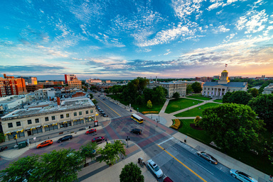 Arial photo of the UI campus Pentacrest taken at sunset