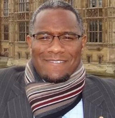 Headshot of Carlton Eley wearing a winter scarf.