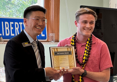 Haifeng Qian presenting award to Seth Dickinson at SPPA commencement reception