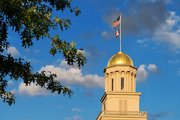 Gold dome of Old Capitol Building on University of Iowa campus.
