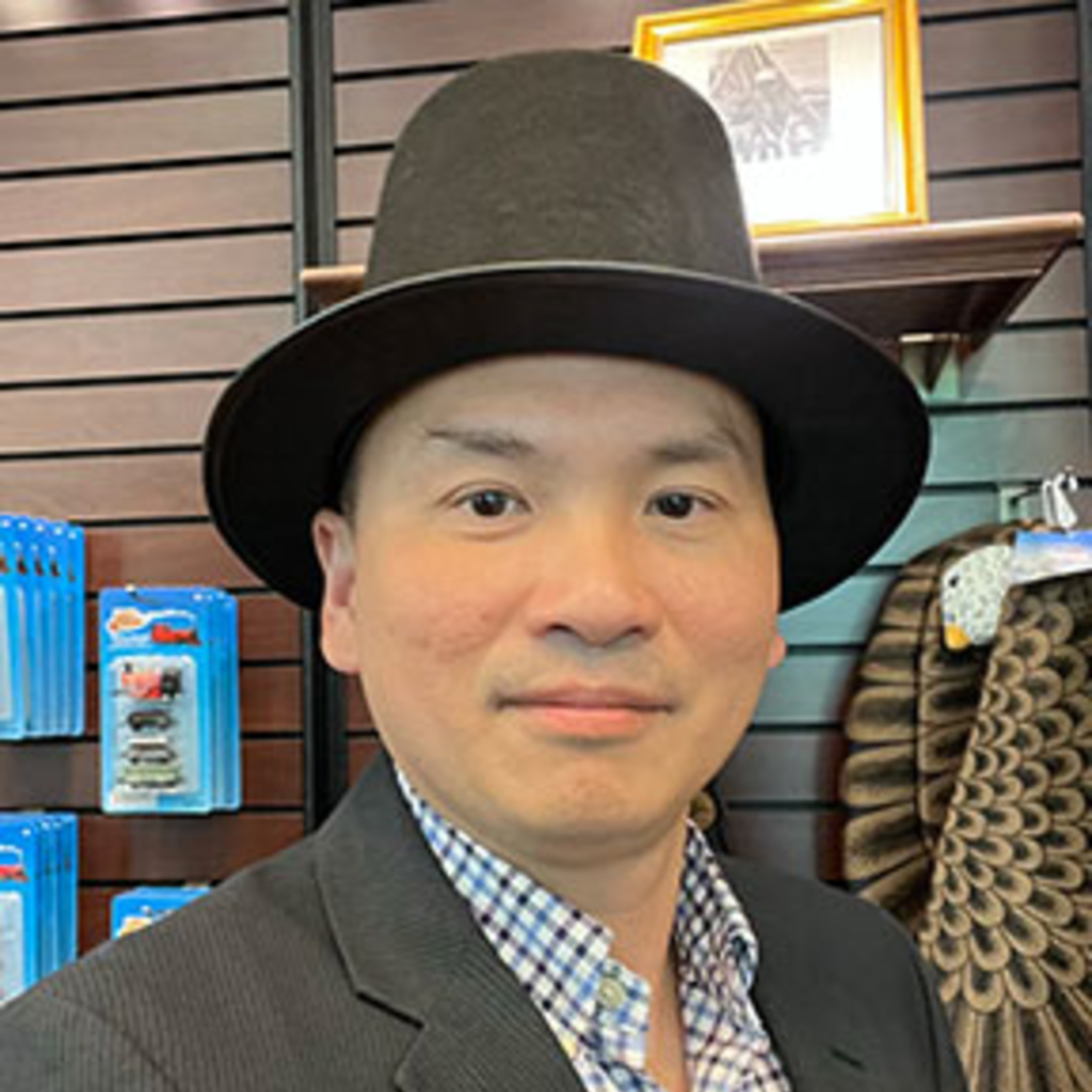 Headshot of Phuong Nguyen wearing a hat.