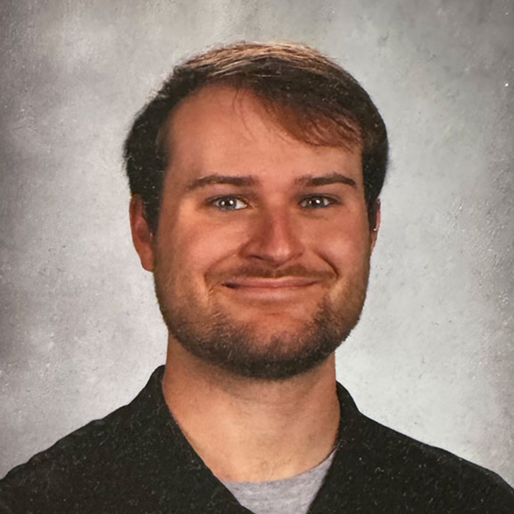 Headshot of Jack Bryson wearing a black sweater. 